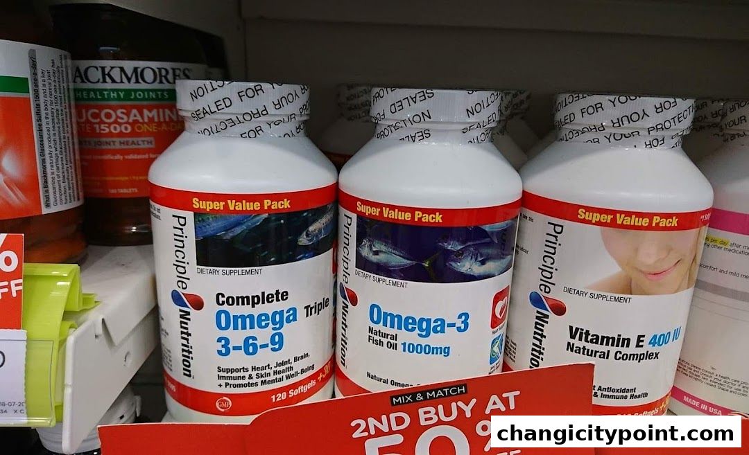 Bottles of Omega-3, Omega 3-6-9, and Vitamin E supplements on a shelf.