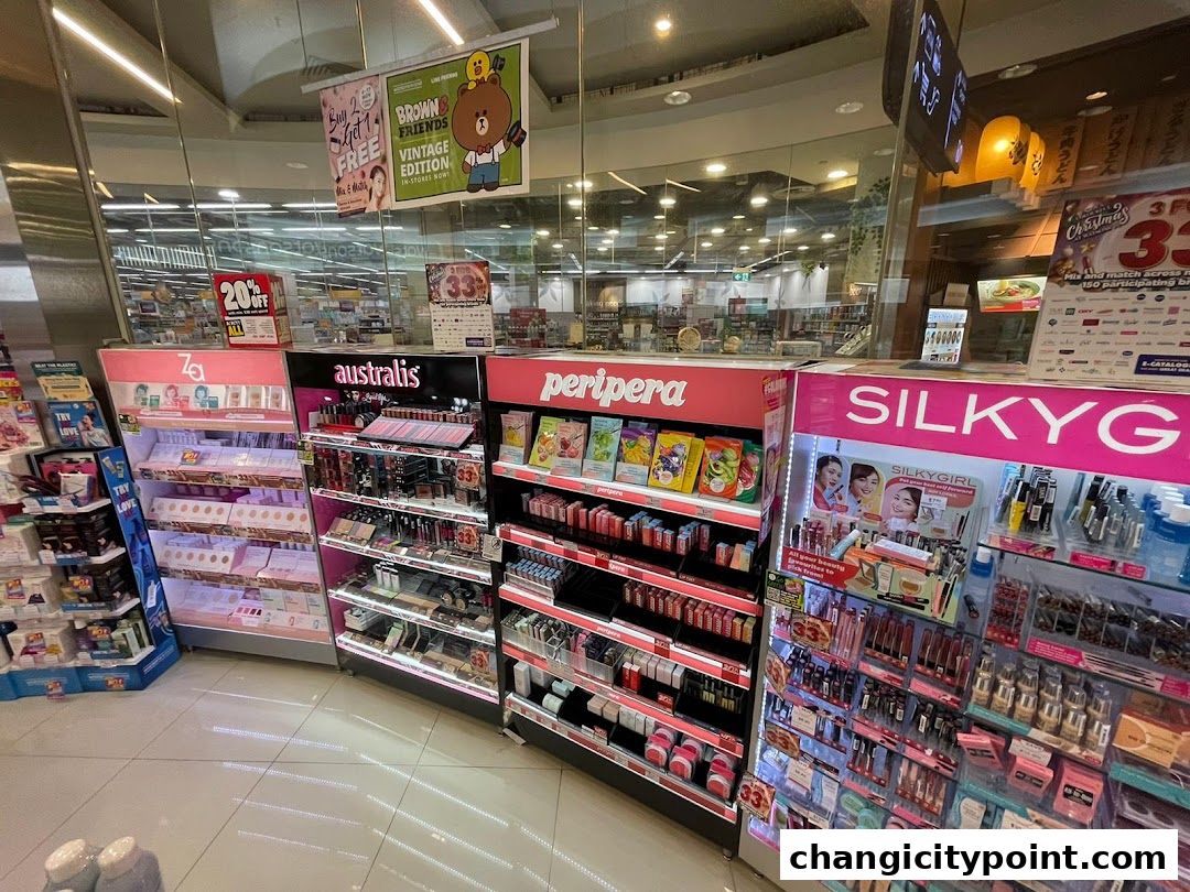 A display of various makeup and beauty products from brands like Za, Australis, Peripera, and Silkygirl.