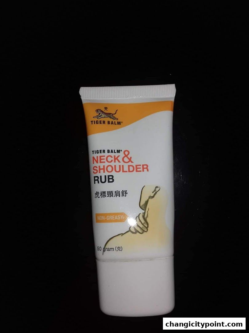 A tube of Tiger Balm Neck & Shoulder Rub with Chinese text and a graphic.