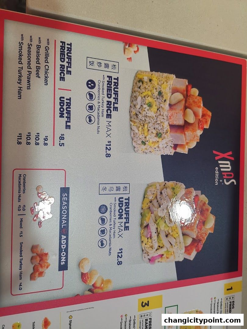 A menu board showcasing truffle fried rice and udon dishes with various add-ons.