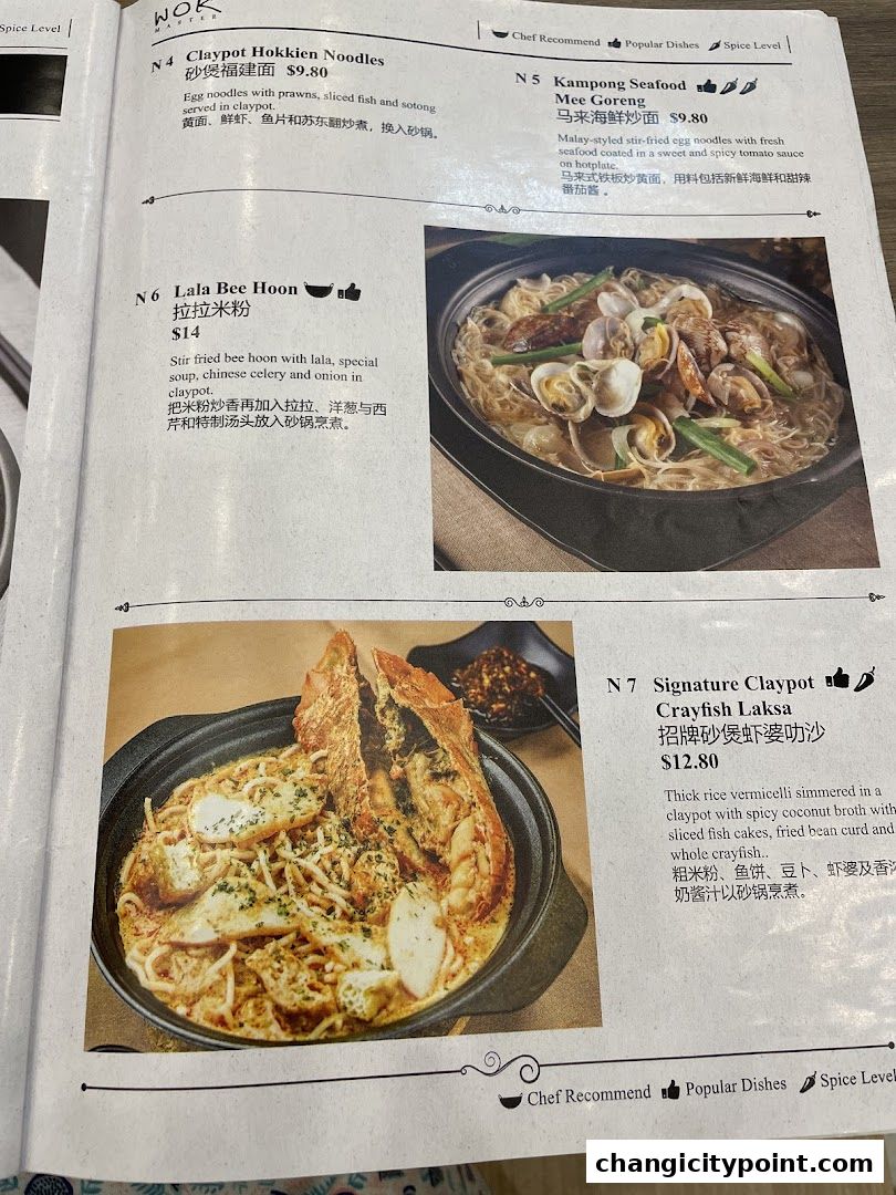 A menu from Wok Master featuring claypot dishes like Hokkien Noodles and Crayfish Laksa.