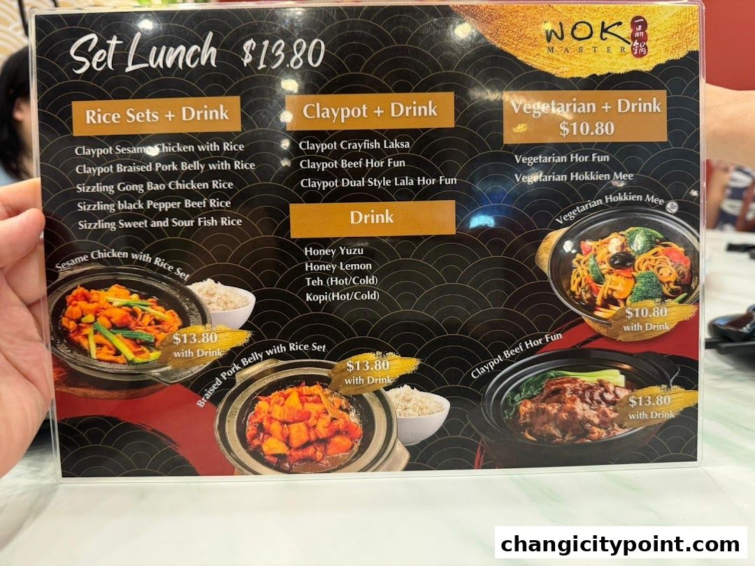A menu for Wok Master featuring set lunches with rice, claypot dishes, and vegetarian options.