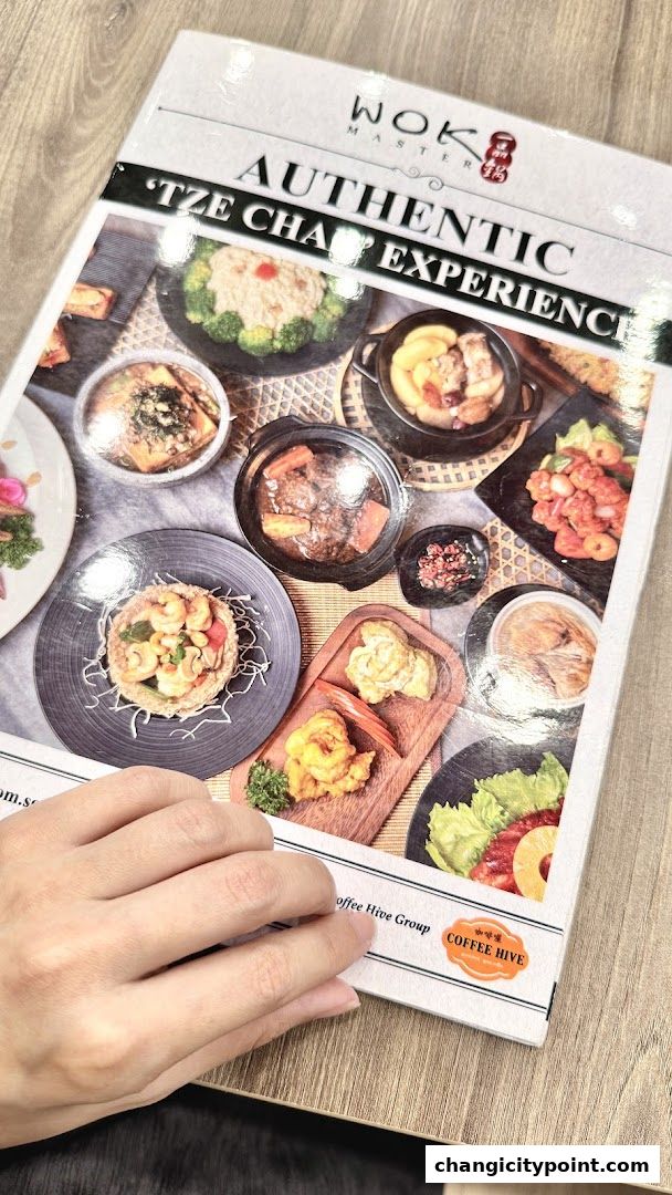 A menu from Wok Master showcasing authentic Tze Char dishes with vibrant food photography.