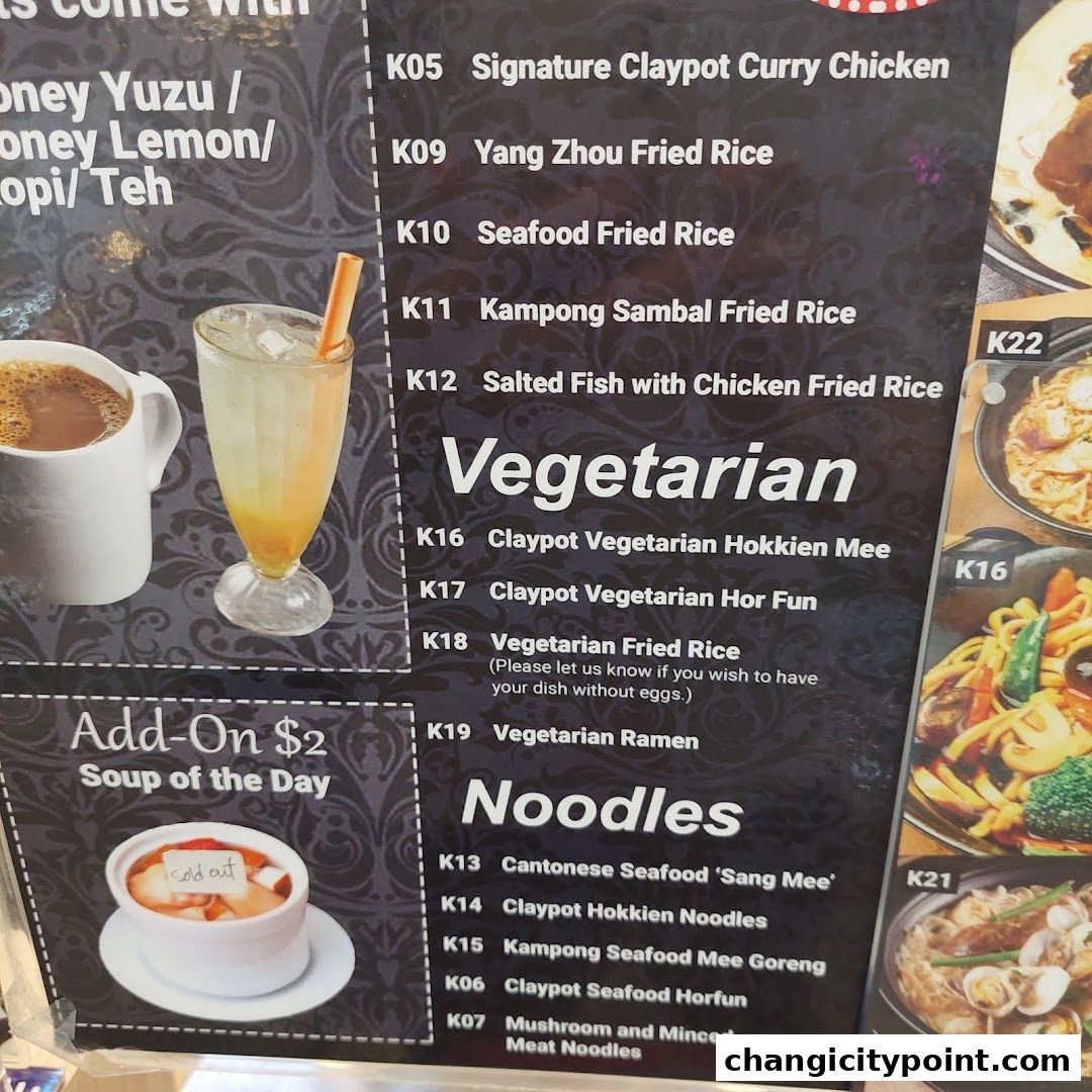 A menu board displays various noodle dishes, vegetarian options, and drinks at Wok Master.