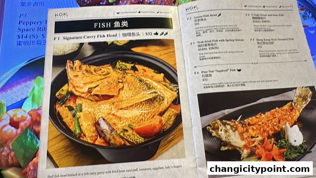 A menu page from Wok Master featuring fish dishes with images and descriptions.