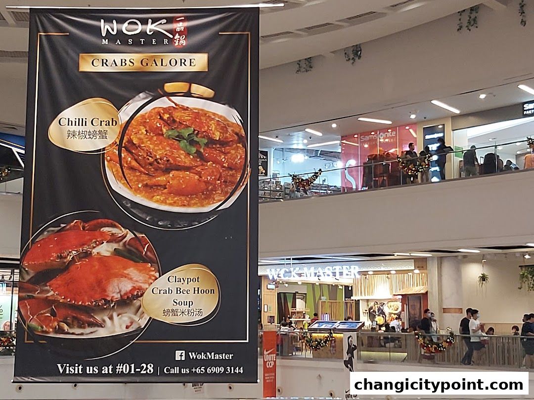 A banner advertises Wok Master's 'Crabs Galore' with images of Chilli Crab and Claypot Crab Bee Hoon Soup.