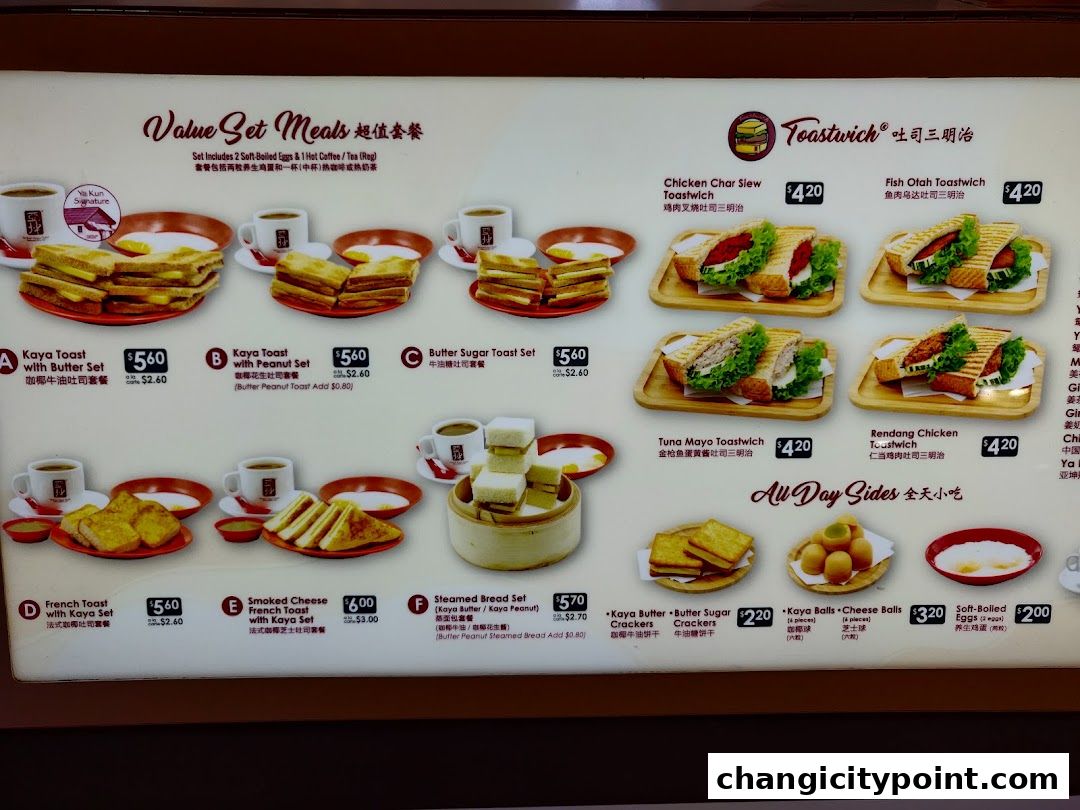 A menu board displaying various set meals, toastwiches, and all-day sides from Ya Kun Kaya Toast.
