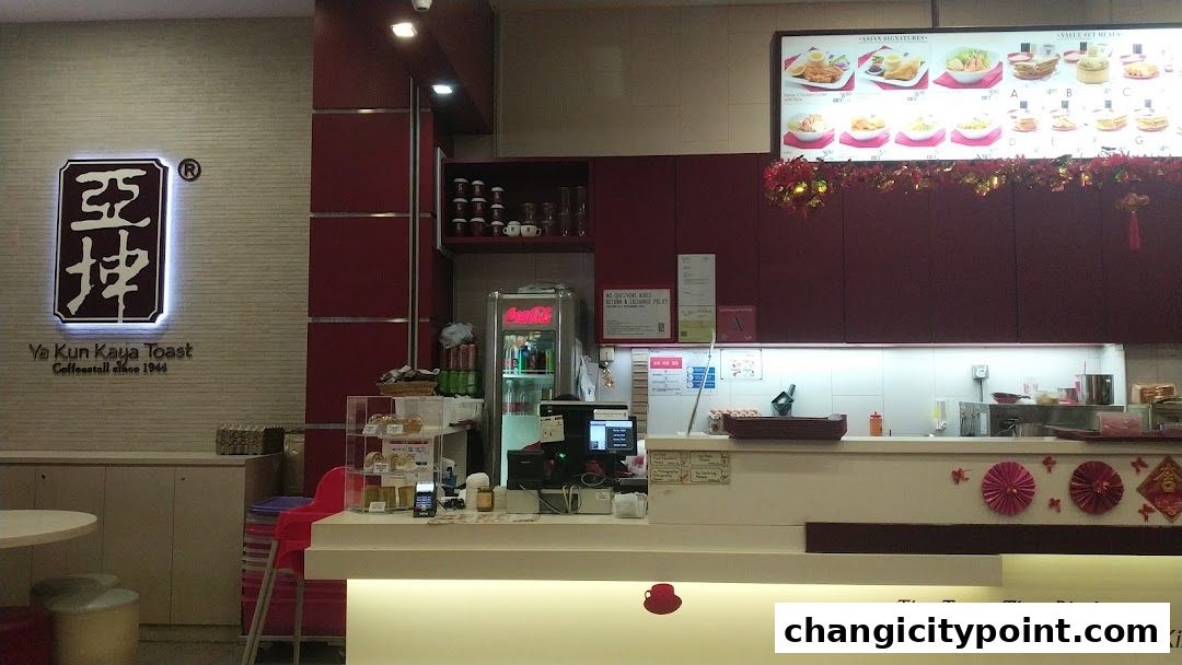 Interior view of Ya Kun Kaya Toast with a menu board and counter.