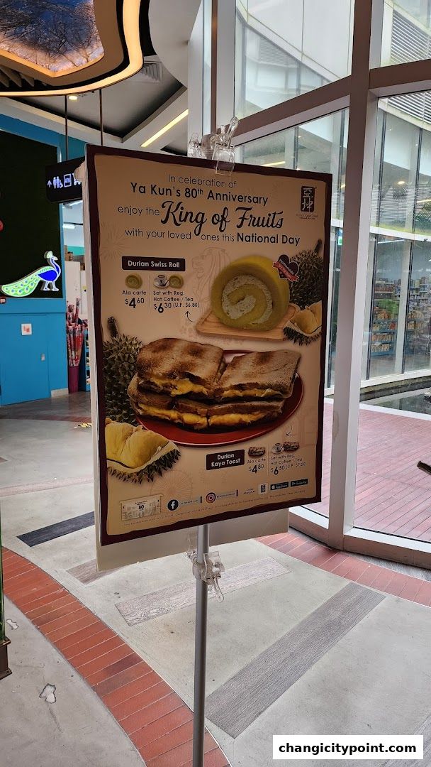 A promotional poster for Ya Kun Kaya Toast featuring durian-flavored treats.