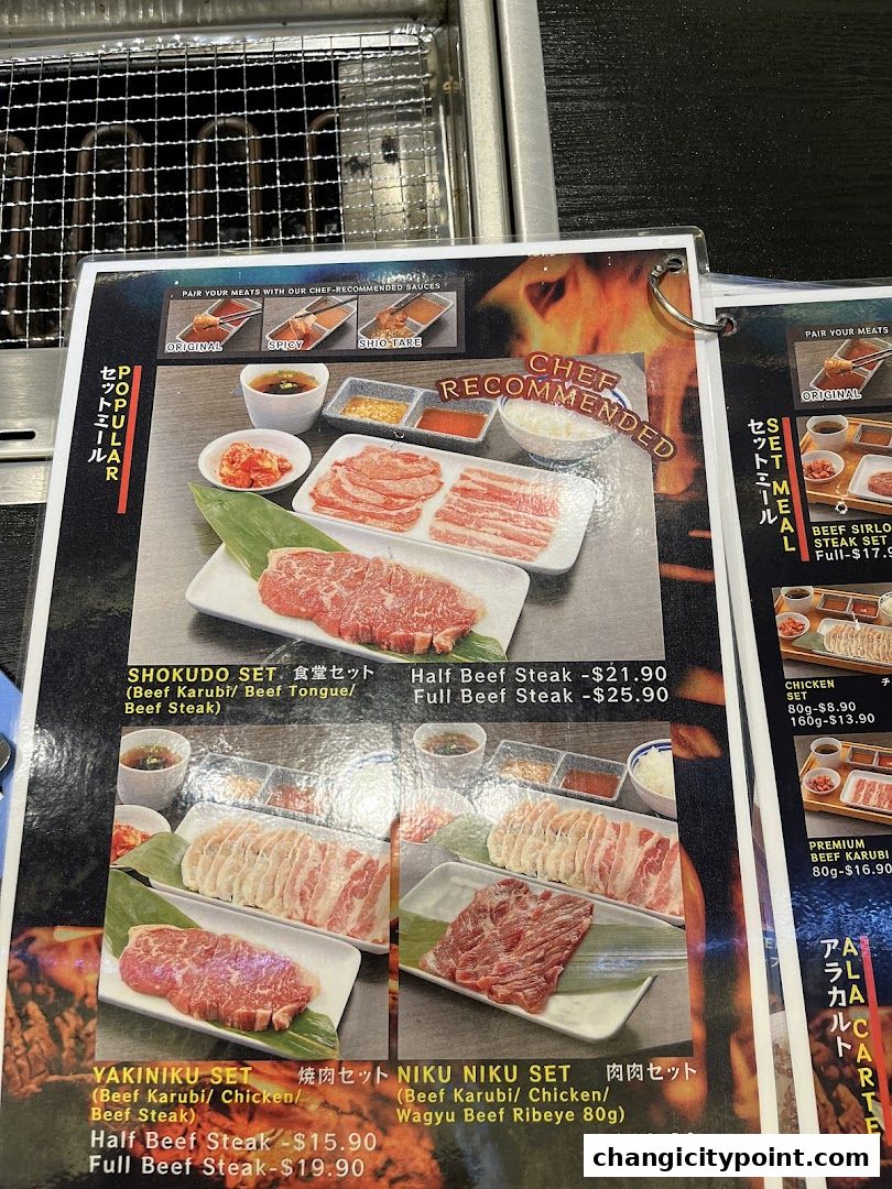 A menu featuring various yakiniku sets with beef and chicken options.